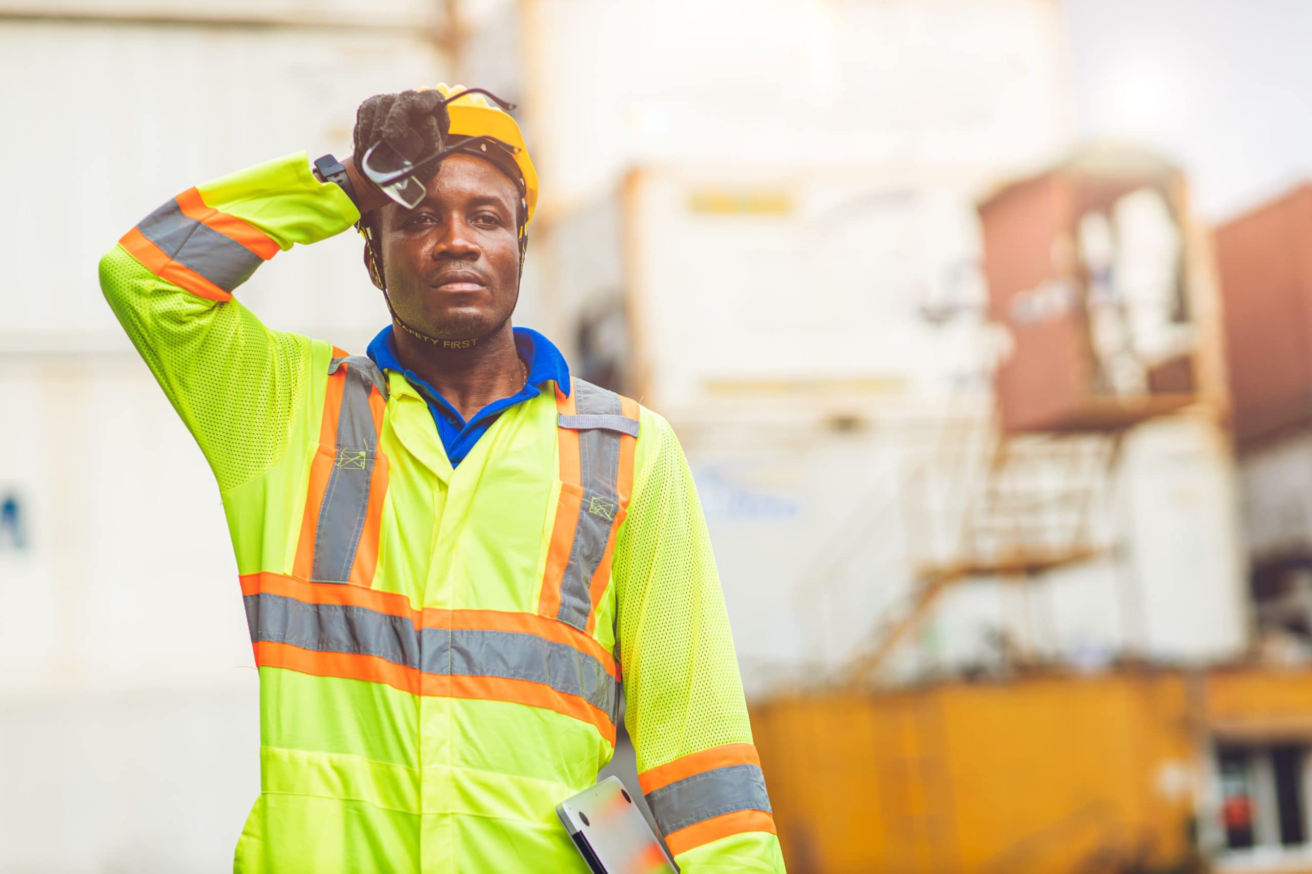 African American black man sweating while working in factory