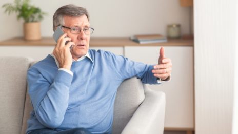 senior man on the phone at home