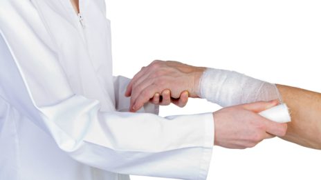 Doctor Tending to patient's injured wrist