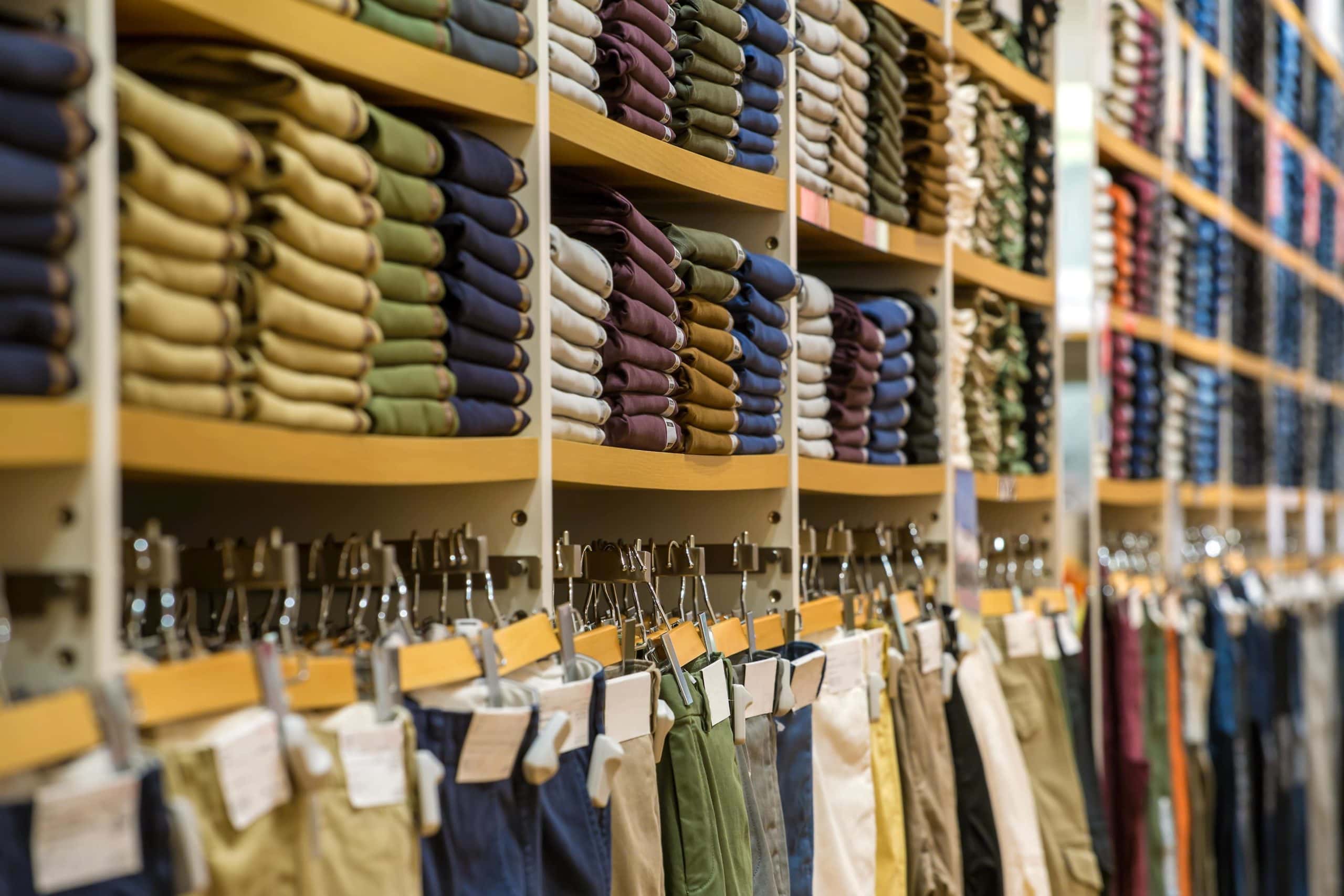 Pants stocked on shelves in retail store